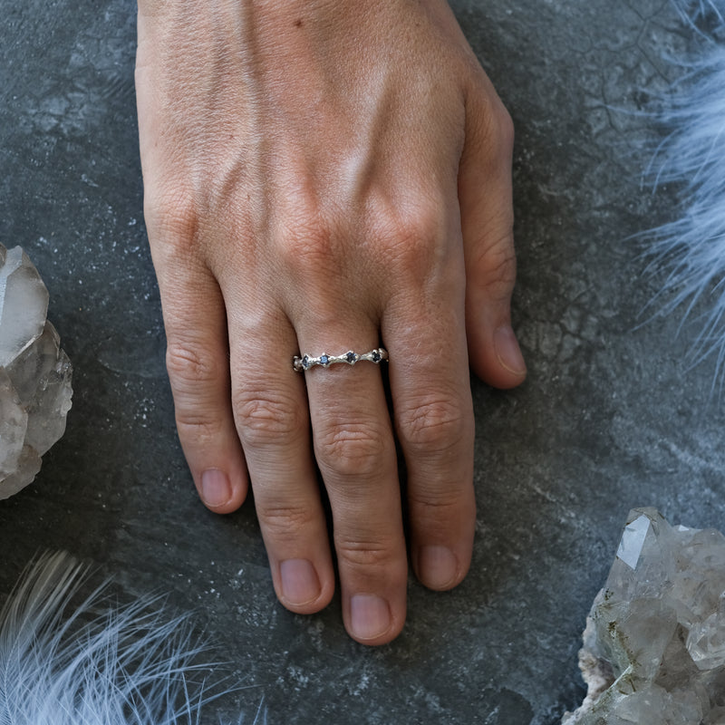 Blue Sapphire Wedding band on hand Blossom