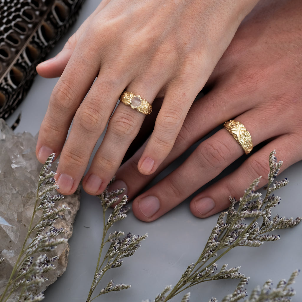 Gold Wedding Rings on hands "Wolves"