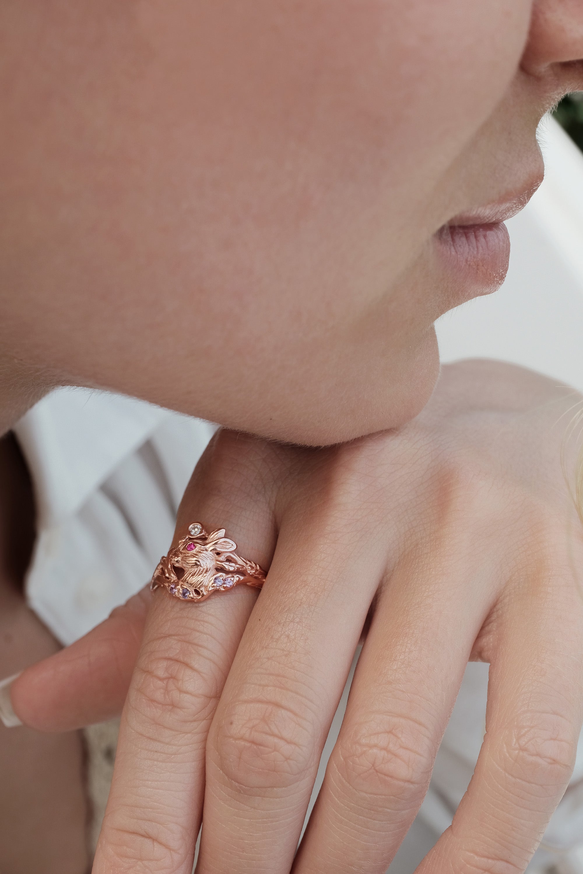 Fairy-core Dream ring in 14K rose gold with a sculpted Lunar Hare, diamond, ruby, and lavender sapphires - a whimsical, symbolic piece for her.