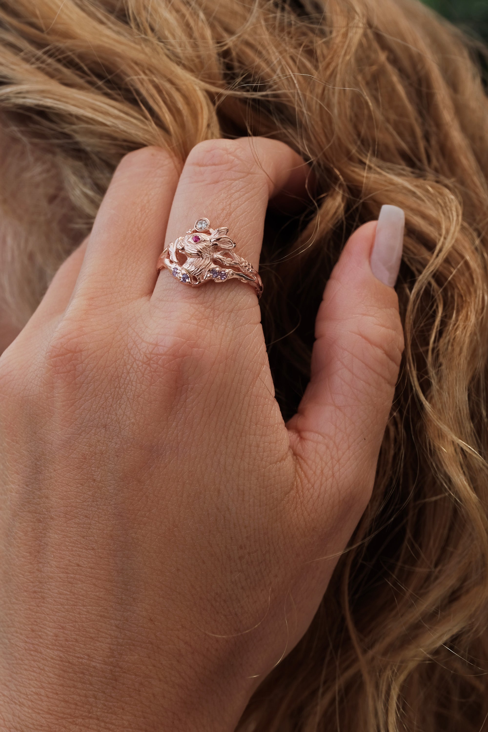 Organic 14K rose gold engagement ring with a carved Lunar Hare and soft gemstone details - a symbolic design for women