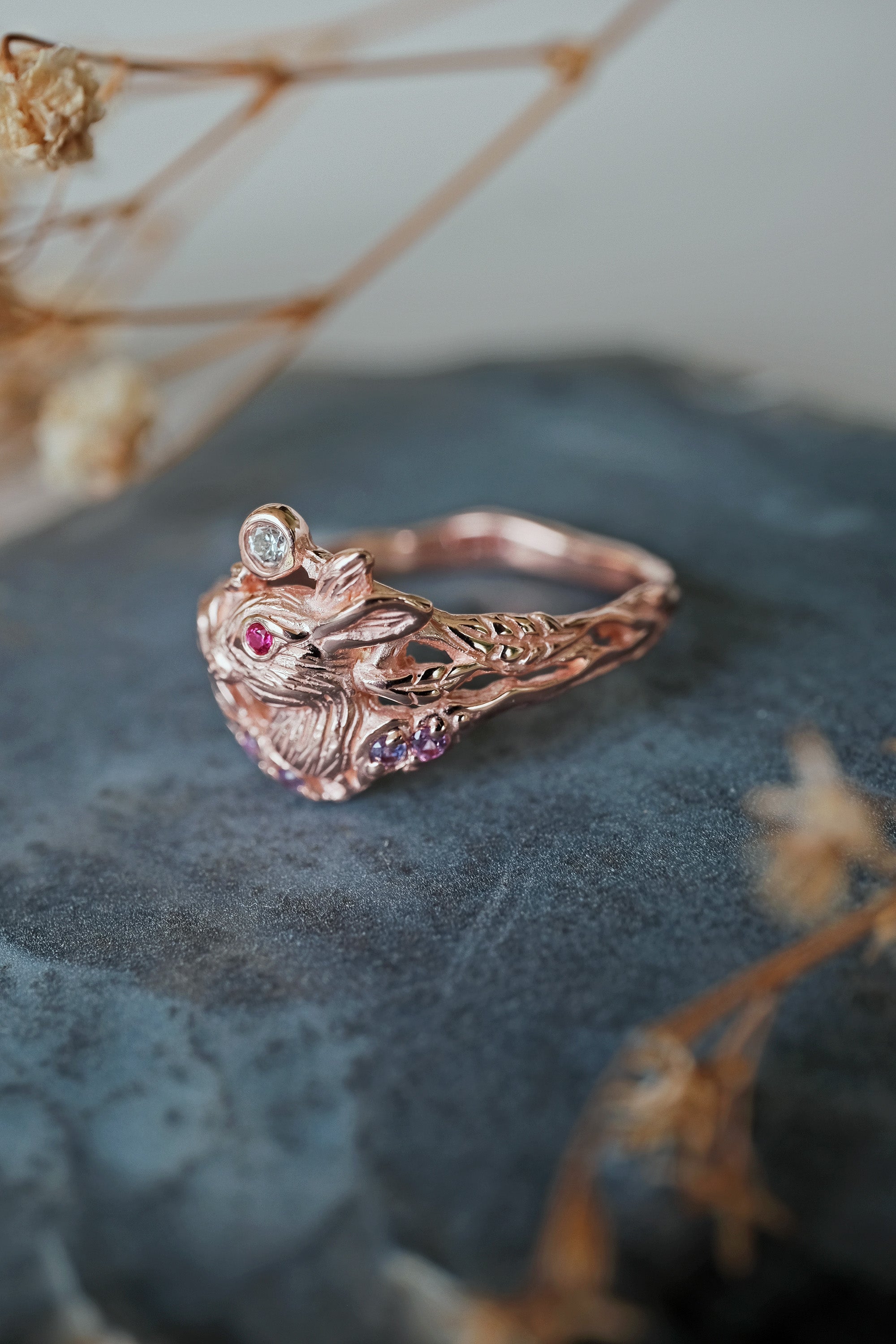 Dream alternative wedding ring featuring a sculpted Lunar Hare with diamond and sapphire accents, a symbolic fine gold piece for her.