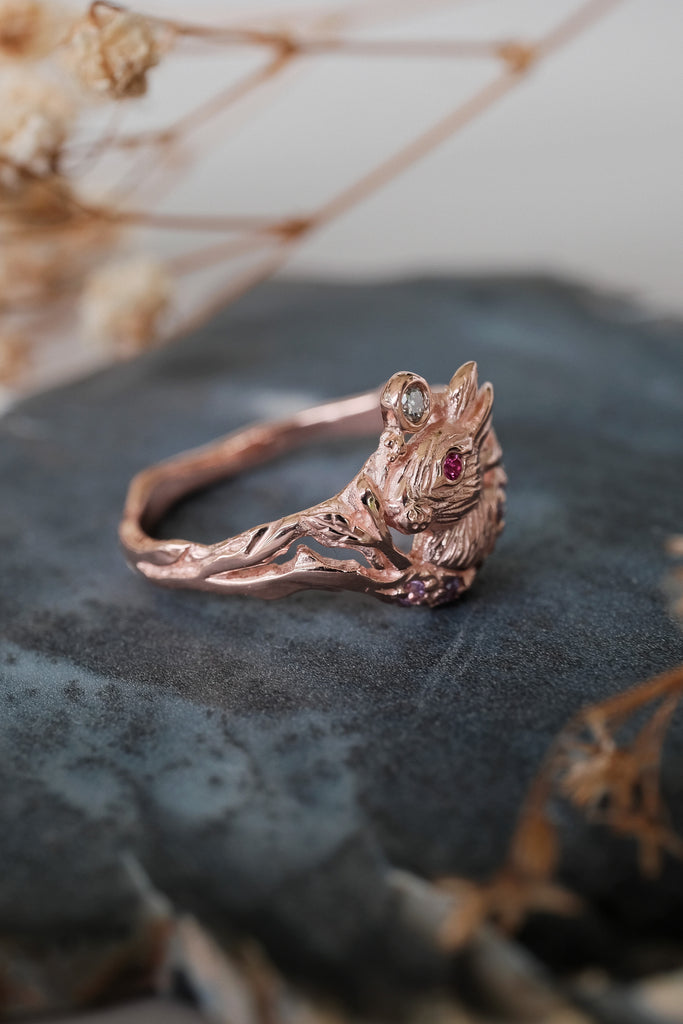 Cottagecore 14K rose gold Dream ring with a Lunar Hare face, diamond, ruby, and lavender sapphires - a poetic wedding or commitment piece