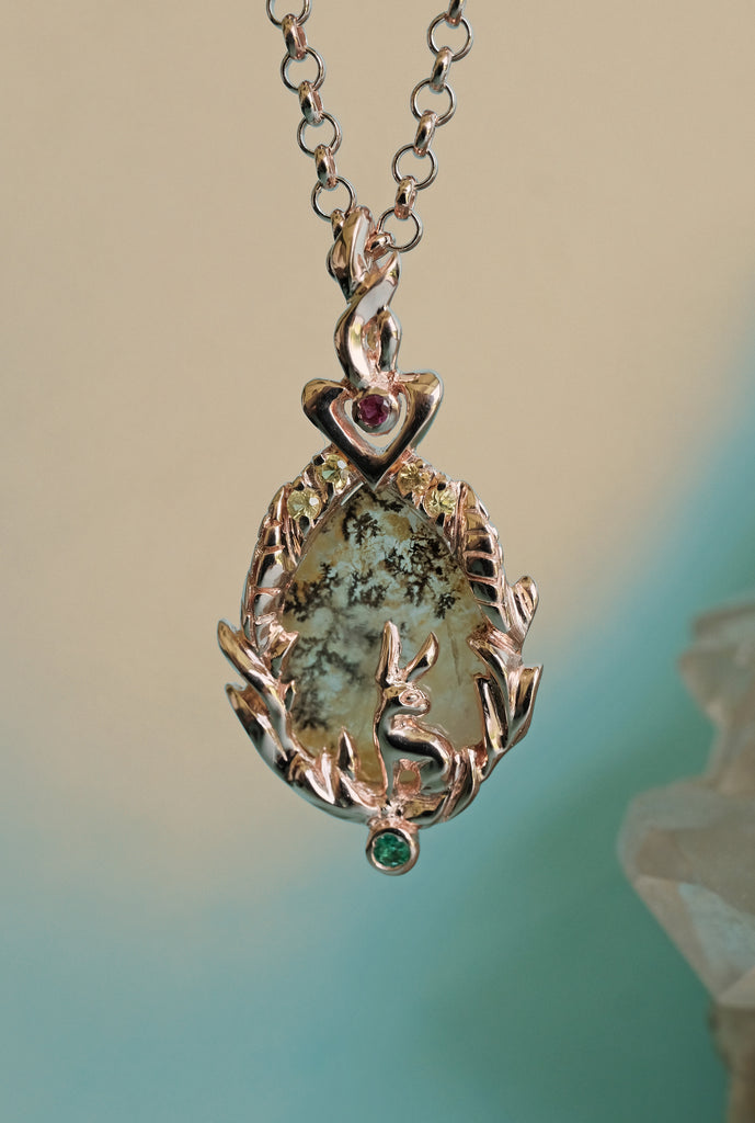 Elven woodland Lunar Hare pendant in solid gold with dendritic agate - a botanical, fantasy-inspired talisman for women who love symbolic jewelry.