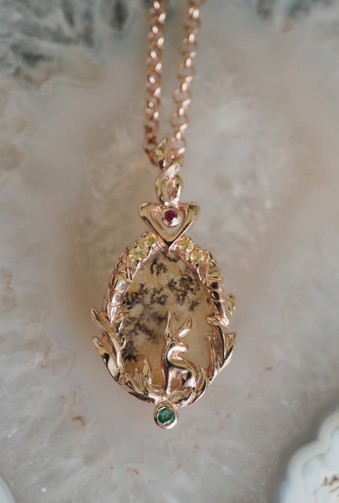Woodland-inspired 14K gold Lunar Hare pendant “Home” with dendritic agate forest scene — symbolic, nature-rooted fine jewelry for her.