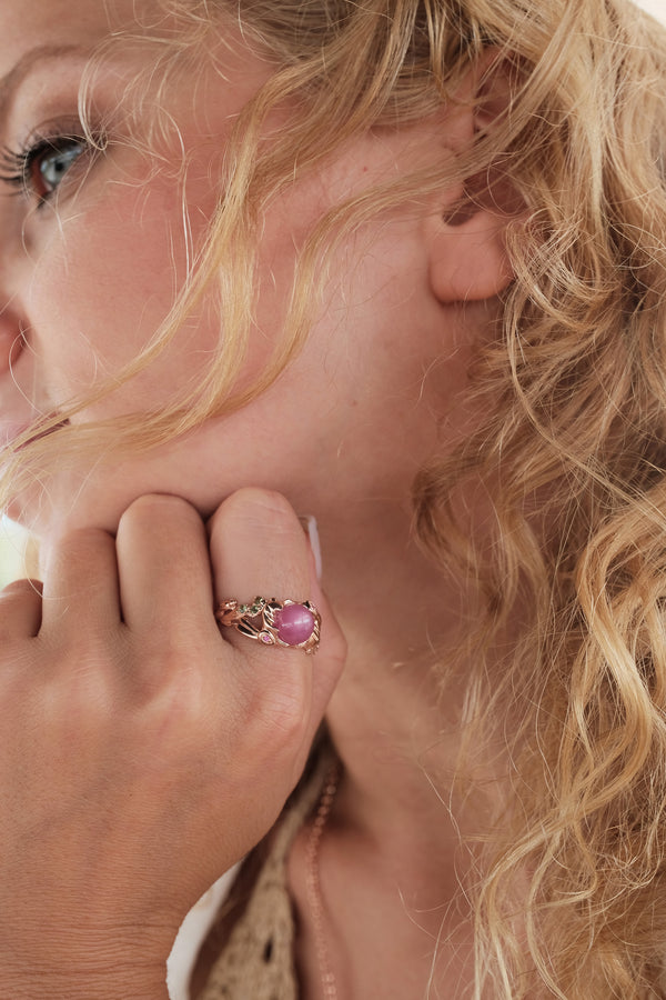 Rise ring for women crafted in solid 14K rose gold with twin lunar hare design, on hand