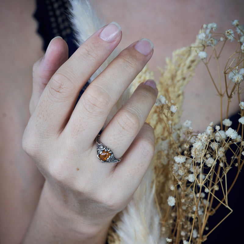 Amber ring "Daisy" on hand