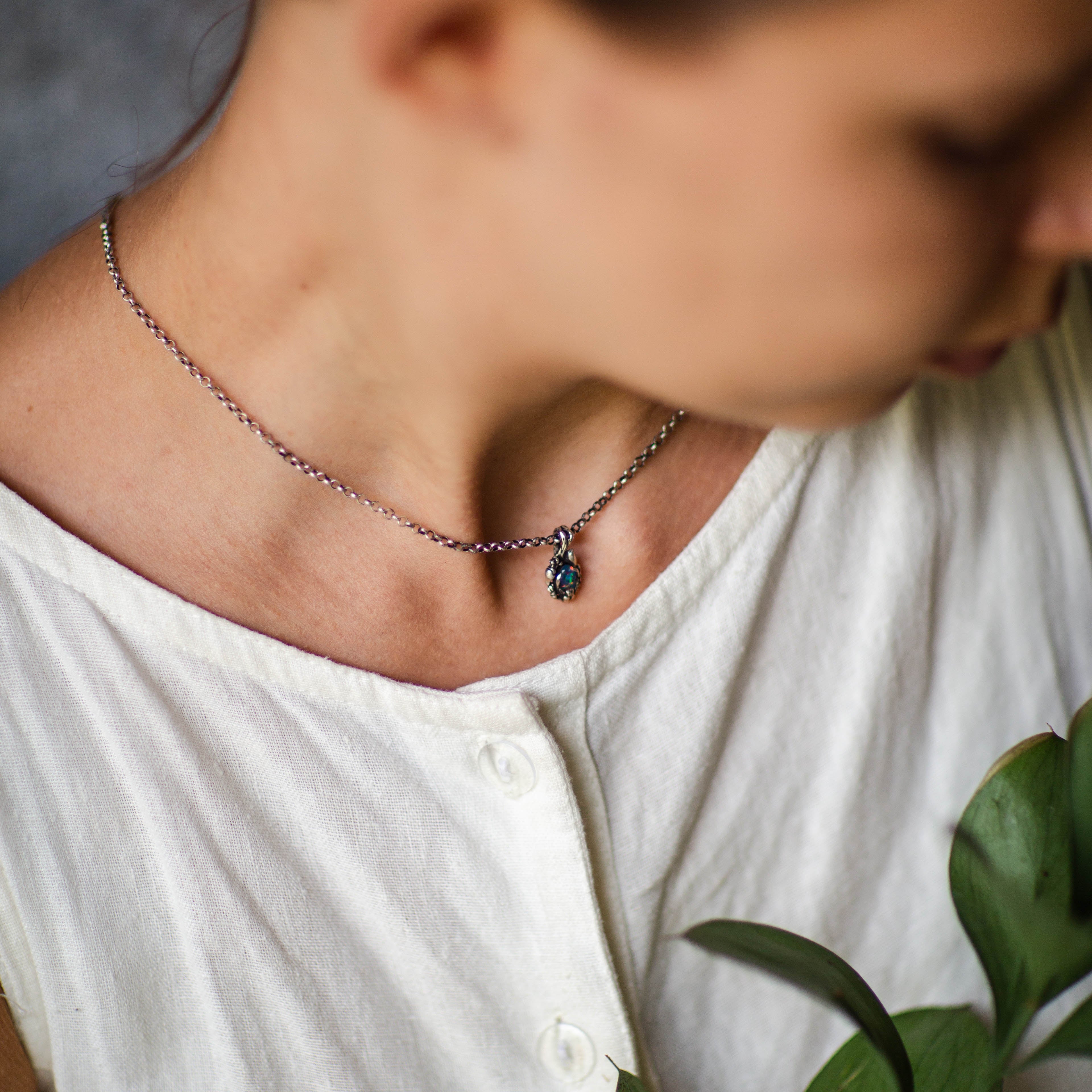 Boulder Fire Opal pendant on the model