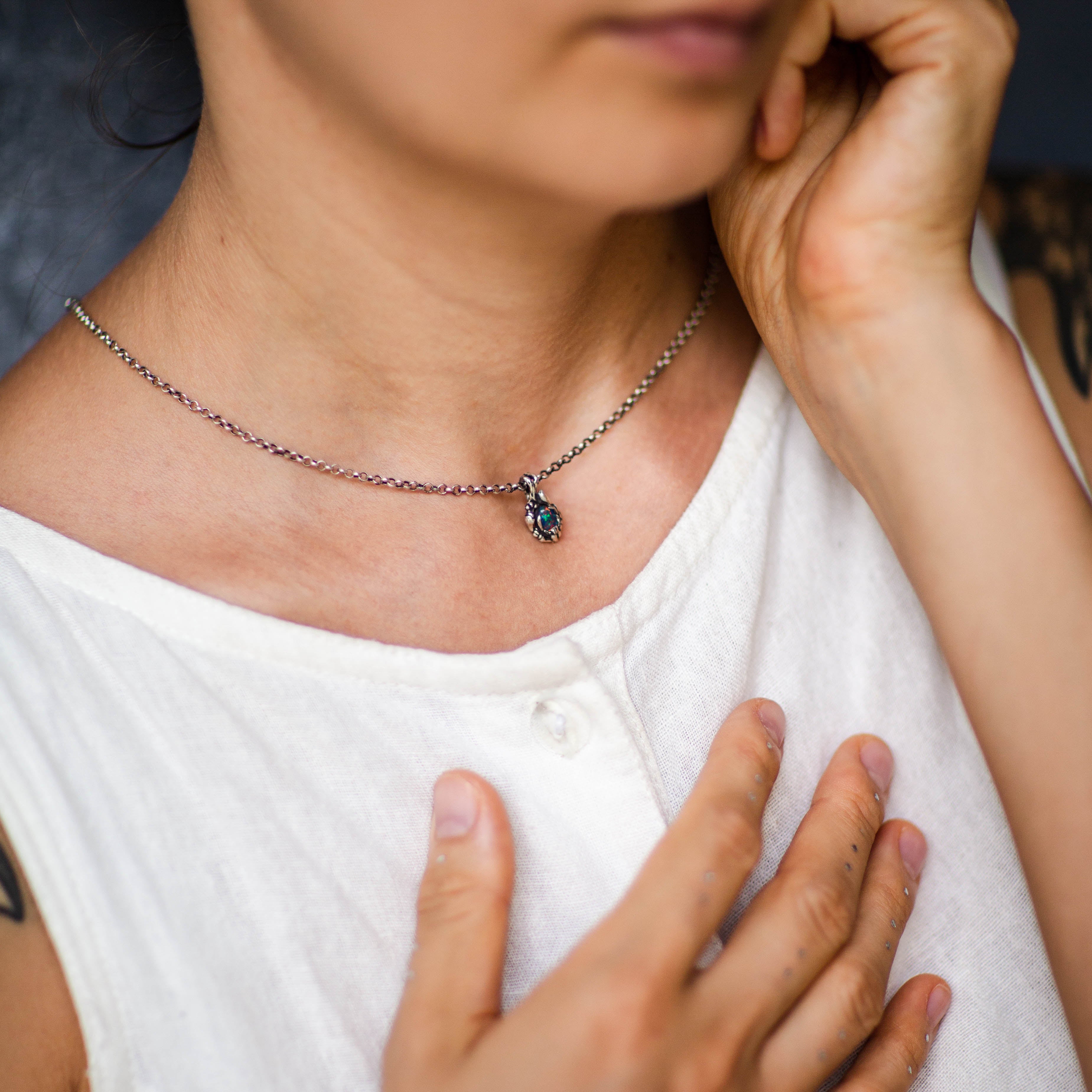 Boulder Fire Opal necklace on the model