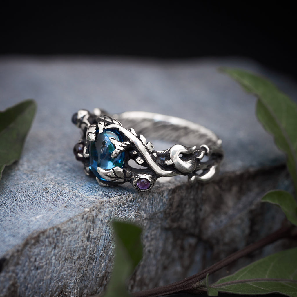 Swiss Blue Topaz ring with 3 small g gemstones