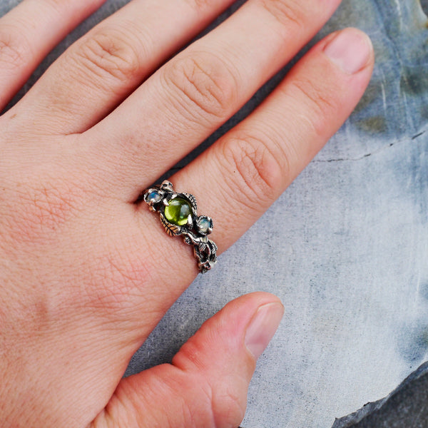 Peridot and Opals ring "Angie" on the hand